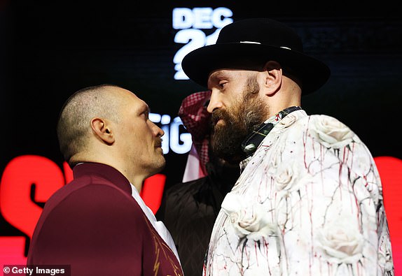 RIYADH, SAUDI ARABIA - DECEMBER 19: Tyson Fury (R) and Oleksandr Usyk face off ahead of the IBF, IBO, WBA, WBC and WBO Undisputed World Heavyweight Title fight between Oleksandr Usyk and Tyson Fury during a press conference as part of Oleksandr Usyk v Tyson Fury 2 at Via Riyadh on December 19, 2024 in Riyadh, Saudi Arabia. (Photo by Richard Pelham/Getty Images)