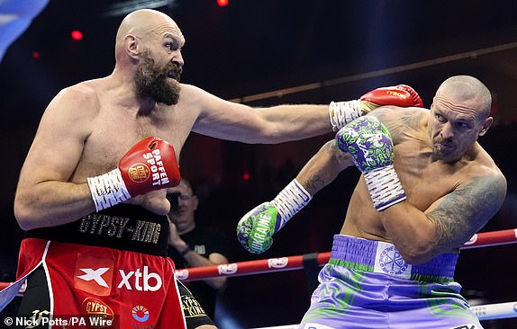 Tyson Fury (left) and Oleksandr Usyk during the WBA, WBC, WBO, IBO World Heavyweight championship contest at the Kingdom Arena in Riyadh, Saudi Arabia. Picture date: Saturday December 21, 2024. PA Photo. See PA story BOXING Fury. Photo credit should read: Nick Potts/PA Wire.RESTRICTIONS: Use subject to restrictions. Editorial use only, no commercial use without prior consent from rights holder.