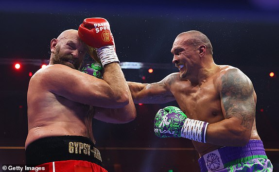 RIYADH, SAUDI ARABIA - DECEMBER 21: Oleksandr Usyk punches Tyson Fury during the IBF, IBO, WBA, WBC and WBO Undisputed World Heavyweight titles' fight between Oleksandr Usyk and Tyson Fury as part of Oleksandr Usyk v Tyson Fury 2, Reignited card at Kingdom Arena on December 21, 2024 in Riyadh, Saudi Arabia. (Photo by Richard Pelham/Getty Images)