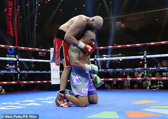 Tyson Fury and Oleksandr Usyk following the WBA, WBC, WBO, IBO World Heavyweight championship contest  at the Kingdom Arena in Riyadh, Saudi Arabia. Picture date: Saturday December 21, 2024. PA Photo. See PA story BOXING Fury. Photo credit should read: Nick Potts/PA Wire.RESTRICTIONS: Use subject to restrictions. Editorial use only, no commercial use without prior consent from rights holder.