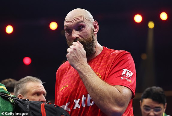 RIYADH, SAUDI ARABIA - DECEMBER 21: Tyson Fury reacts following defeat in the IBF, IBO, WBA, WBC and WBO Undisputed World Heavyweight titles' fight between Oleksandr Usyk and Tyson Fury as part of Oleksandr Usyk v Tyson Fury 2, Reignited card at Kingdom Arena on December 21, 2024 in Riyadh, Saudi Arabia. (Photo by Richard Pelham/Getty Images)