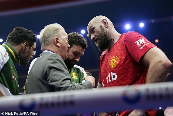 Tyson Fury with Frank Warren following the WBA, WBC, WBO, IBO World Heavyweight championship contest against Oleksandr Usyk at the Kingdom Arena in Riyadh, Saudi Arabia. Picture date: Saturday December 21, 2024. PA Photo. See PA story BOXING Fury. Photo credit should read: Nick Potts/PA Wire.RESTRICTIONS: Use subject to restrictions. Editorial use only, no commercial use without prior consent from rights holder.