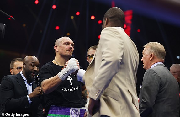 RIYADH, SAUDI ARABIA - DECEMBER 21: Oleksandr Usyk shakes hands with Daniel Dubois in the ring following victory in the IBF, IBO, WBA, WBC and WBO Undisputed World Heavyweight titles' fight between Oleksandr Usyk and Tyson Fury as part of Oleksandr Usyk v Tyson Fury 2, Reignited card at Kingdom Arena on December 21, 2024 in Riyadh, Saudi Arabia. (Photo by Richard Pelham/Getty Images)