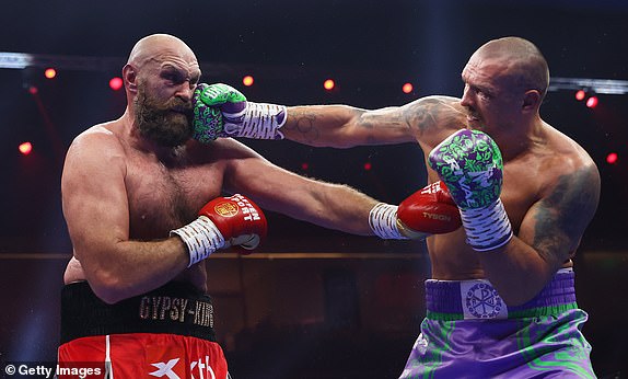 RIYADH, SAUDI ARABIA - DECEMBER 21: Oleksandr Usyk punches Tyson Fury during the IBF, IBO, WBA, WBC and WBO Undisputed World Heavyweight titles' fight between Oleksandr Usyk and Tyson Fury as part of Oleksandr Usyk v Tyson Fury 2, Reignited card at Kingdom Arena on December 21, 2024 in Riyadh, Saudi Arabia. (Photo by Richard Pelham/Getty Images)