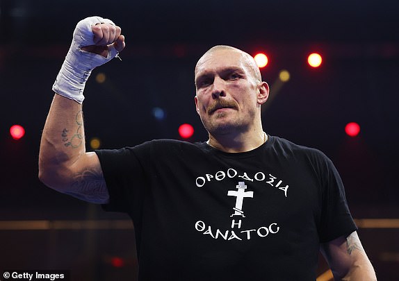 RIYADH, SAUDI ARABIA - DECEMBER 21: Oleksandr Usyk celebrates victory following the IBF, IBO, WBA, WBC and WBO Undisputed World Heavyweight titles' fight between Oleksandr Usyk and Tyson Fury as part of Oleksandr Usyk v Tyson Fury 2, Reignited card at Kingdom Arena on December 21, 2024 in Riyadh, Saudi Arabia. (Photo by Richard Pelham/Getty Images)