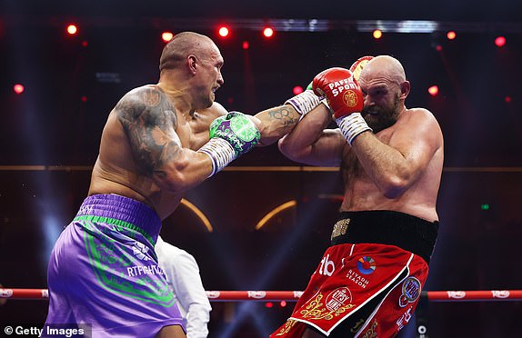 RIYADH, SAUDI ARABIA - DECEMBER 21: Oleksandr Usyk punches Tyson Fury during the IBF, IBO, WBA, WBC and WBO Undisputed World Heavyweight titles' fight between Oleksandr Usyk and Tyson Fury as part of Oleksandr Usyk v Tyson Fury 2, Reignited card at Kingdom Arena on December 21, 2024 in Riyadh, Saudi Arabia. (Photo by Richard Pelham/Getty Images)