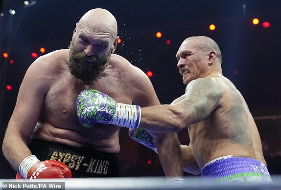 Tyson Fury (left) and Oleksandr Usyk during the WBA, WBC, WBO, IBO World Heavyweight championship contest at the Kingdom Arena in Riyadh, Saudi Arabia. Picture date: Saturday December 21, 2024. PA Photo. See PA story BOXING Fury. Photo credit should read: Nick Potts/PA Wire.RESTRICTIONS: Use subject to restrictions. Editorial use only, no commercial use without prior consent from rights holder.