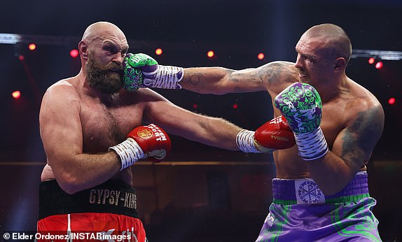 RIYADH, SAUDI ARABIA - DECEMBER 21: Oleksandr Usyk punches Tyson Fury during the IBF, IBO, WBA, WBC and WBO Undisputed World Heavyweight titles' fight between Oleksandr Usyk and Tyson Fury as part of Oleksandr Usyk v Tyson Fury 2, Reignited card at Kingdom Arena on December 21, 2024 in Riyadh, Saudi Arabia. (Photo by Richard Pelham/Getty Images)