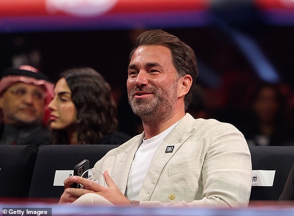 RIYADH, SAUDI ARABIA - DECEMBER 21: Chairman of Matchroom Boxing Eddie Hearn laughs with Chairman of General Authority for Entertainment Turki Alalashikh during the Oleksandr Usyk v Tyson Fury 2 event at Kingdom Arena on December 21, 2024 in Riyadh, Saudi Arabia. (Photo by Mark Robinson/Getty Images)