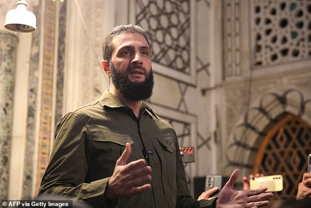 Ahmed al-Sharaa addresses a crowd at the capital's landmark Umayyad Mosque on December 8