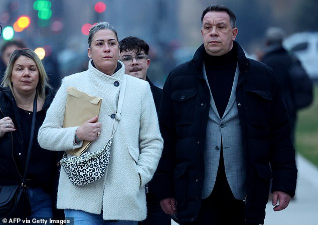 Caroline Darian (2nd L) and David Pelicot (R) arrive at the courthouse in Avignon on December 19, 2024, as the verdict is expected in the trial of their father