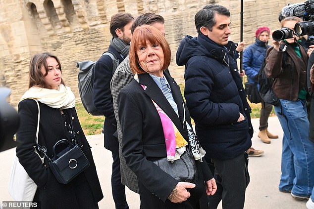 Frenchwoman Gisele Pelicot, the victim of an alleged mass rape orchestrated by her then-husband Dominique Pelicot at their home in the southern French town of Mazan, arrives at court with her lawyers