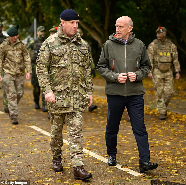 Defence Secretary John Healey (right) is open to sending UK troops to Ukraine to train new recruits there. He is seen speaking with British soldiers at the Stanford Training Area on October 20, 2024 near Thetford, England