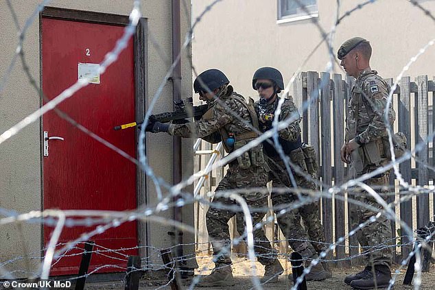 Ukrainian soldiers put their new skills into action, breaching a building while a British Army instructor watches on