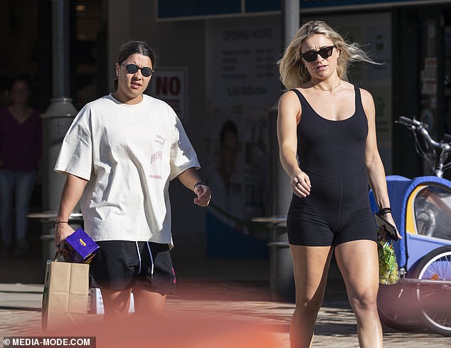 Kristie, who is a West Ham United midfielder, completed her athletic ensemble with a pair of black sandals and shielded her eyes with dark square sunglasses