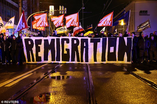 Hard-right demonstrators take part in a protest after a car drove into the crowd at the market