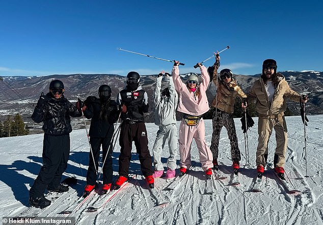 Heidi wore the same exact snowsuit on Saturday when she took a family snap on the summit