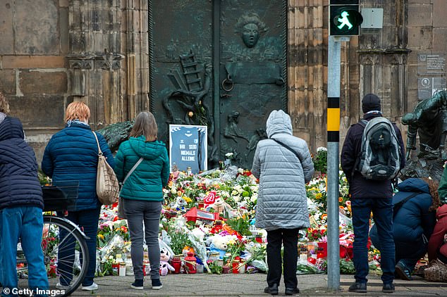 The sign at the Johanniskirche near the now closed Christmas market reads You are never alone on December 23, 2024 in Magdeburg