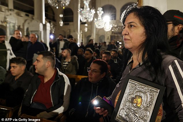 Christian worshippers stage a sit-in inside the Mariamite Church in Damascus early on December 24, 2024