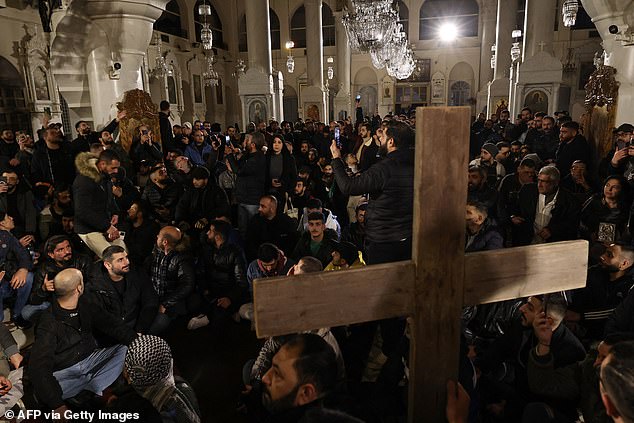 Hundreds of demonstrators took to the streets in Christian areas of Damascus early on December 24