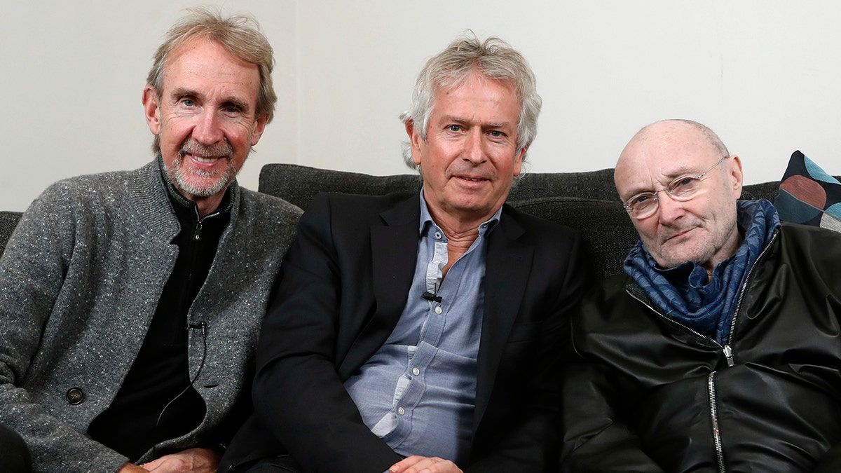 From left: Genesis band members Mike Rutherford, Tony Banks and Phil Collins pose during an interview in London on March 4, 2020.