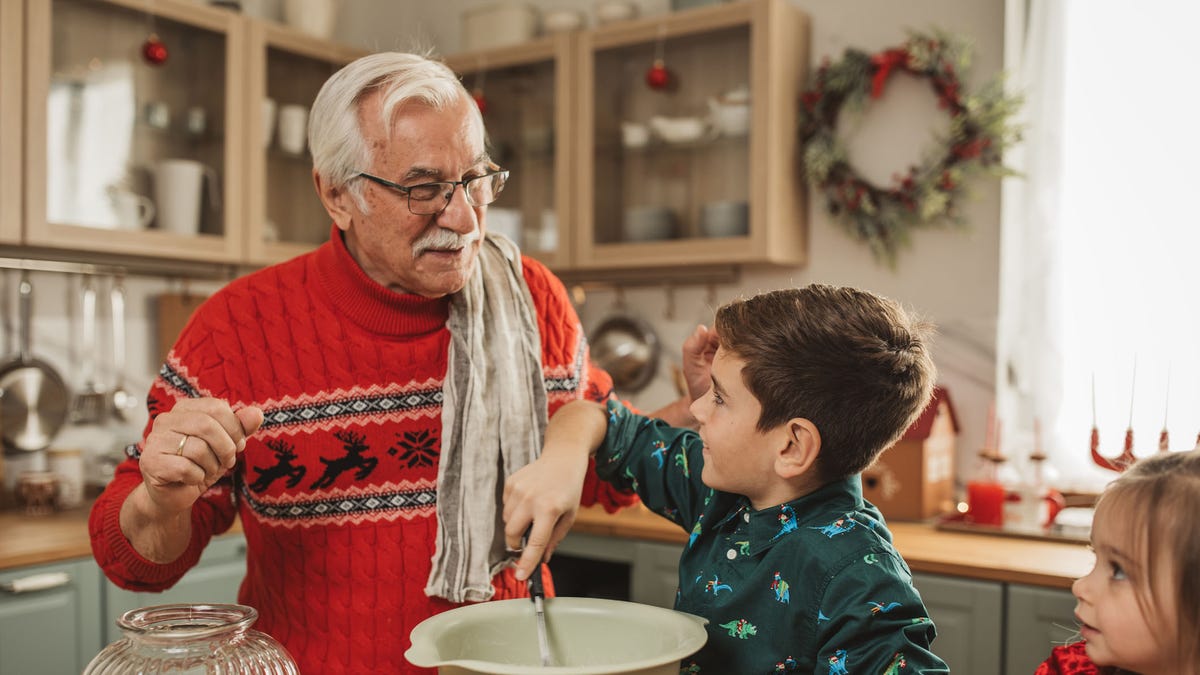 Grandpa cooking with grandson