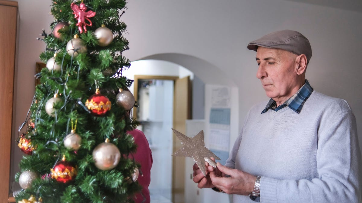 Man decorating tree