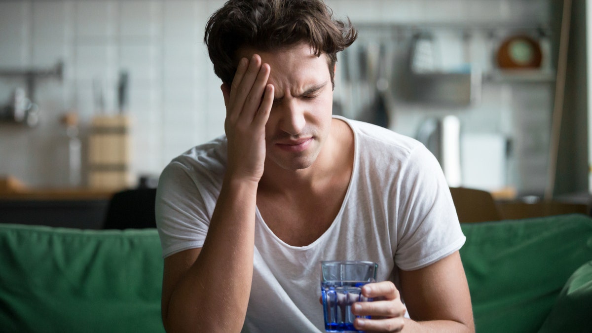 man suffering a headache