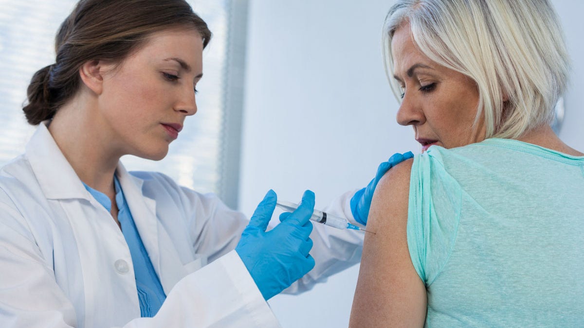 Woman getting vaccine