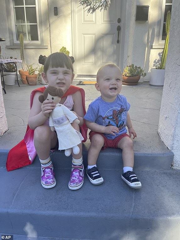 This photo provided by Anna Yaeger shows her daughter and son on the front porch of their Altadena, Calif., home on Aug. 12, 2022, something she did nearly daily until her home burned in the January 2025 wildfires. (Anna Yeager via AP)