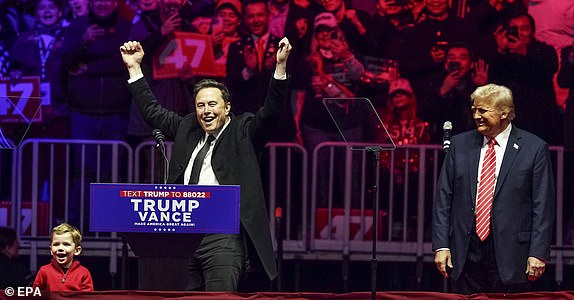 epa11837519 US President-elect Donald Trump (R) with businessman Elon Musk (C) and Musk's son, X, (L) on stage during a rally at Capital One Arena in Washington, DC, USA, 19 January 2025. President-elect Donald Trump, who defeated Joe Biden to become the 47th president of the United States, will be inaugurated on 20 January, though all of the planned outdoor ceremonies and events have been cancelled due to a forecast of extreme cold temperatures.  EPA/WILL OLIVER