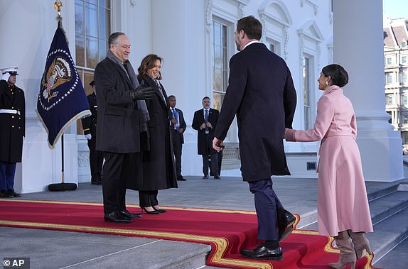 Vice President Kamala Harris, center left, and second gentleman Doug Emhoff, left, greet Vice President-elect JD Vance, center right, and his wife Usha Vance, right, upon arriving at the White House, Monday, Jan. 20, 2025, in Washington. (AP Photo/Evan Vucci)