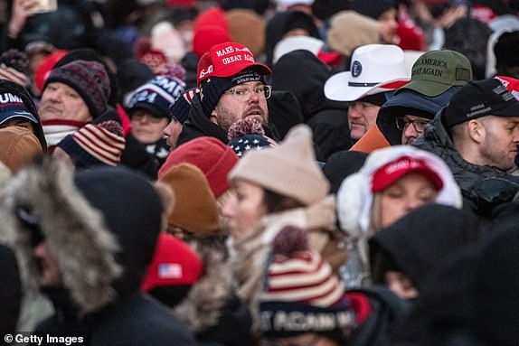 WASHINGTON, DC - JANUARY 20: A crowd waits in line to get into Capital One Arena for Donald Trump's inauguration celebration on January 20, 2025 in Washington, DC. U.S. President-elect Donald Trump and Vice President-elect JD Vance will be sworn in on January 20 in an indoor ceremony in the rotunda of the U.S. Capitol with a celebration at the Arena after. (Photo by Stephanie Keith/Getty Images)