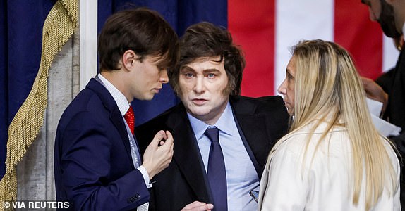 Argentina's President Javier Milei (C) attends Donald Trump's inauguration as the next President of the United States in the rotunda of the United States Capitol in Washington, DC, USA, 20 January 2025. Trump, who defeated Kamala Harris, is being sworn in today as the 47th president of the United States, though the planned outdoor ceremonies and events have been cancelled due to a forecast of extreme cold temperatures.    SHAWN THEW/POOL/Pool via REUTERS