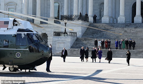 WASHINGTON, DC - JANUARY 20: U.S. President Donald Trump and first lady Melania Trump accompany former U.S. President Joe Biden and former first lady Jill Biden to Marine One as the Bidens depart the U.S. Capitol on January 20, 2025 in Washington, DC. Donald Trump takes office for his second term as the 47th president of the United States. (Photo by Joe Raedle/Getty Images)