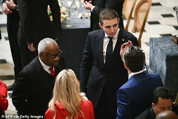 (L-R) US Supreme Court Associate Justice Clarence Thomas, Barron Trump and Secretary of Defense nominee Pete Hegseth attend a luncheon in honor of newly sworn in US President Donald Trump, in Statuary Hall at the US Capitol in Washington, DC, on January 20, 2025. (Photo by Brendan SMIALOWSKI / AFP) (Photo by BRENDAN SMIALOWSKI/AFP via Getty Images)