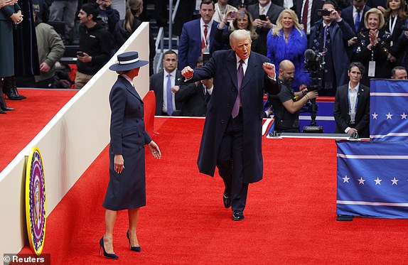 U.S. President Donald Trump dances as he and first lady Melania Trump arrive at Capital One arena on the inauguration day of his second presidential term, in Washington, U.S., January 20, 2025. REUTERS/Brian Snyder