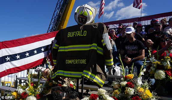 epa11644050 A memorial for firefighter Corey Comperatore, who died during an assassination attempt on Republican presidential nominee and former US president Donald Trump, on display ahead of a campaign rally with President Trump at the Butler Farm Show in Butler, Pennsylvania, USA, 05 October 2024. The rally will take place at the same location where a gunman attempted to assassinate former president Trump in July.  EPA/WILL OLIVER