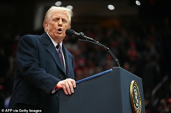 US President Donald Trump speaks during the inaugural parade inside Capital One Arena, in Washington, DC, on January 20, 2025. (Photo by Jim WATSON / AFP) (Photo by JIM WATSON/AFP via Getty Images)