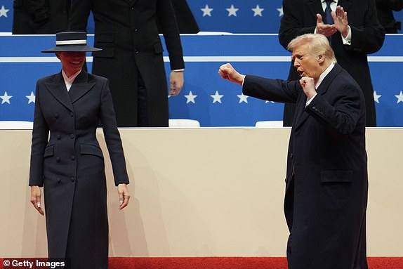 WASHINGTON, DC - JANUARY 20: First lady Melania Trump and U.S. President Donald Trump arrive for an indoor inauguration parade at the Capital One Arena on January 20, 2025 in Washington, DC. Donald Trump takes office for his second term as the 47th president of the United States. (Photo by Christopher Furlong/Getty Images)