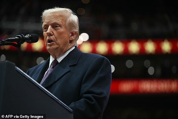 US President Donald Trump speaks during the inaugural parade inside Capital One Arena, in Washington, DC, on January 20, 2025. (Photo by Jim WATSON / AFP) (Photo by JIM WATSON/AFP via Getty Images)