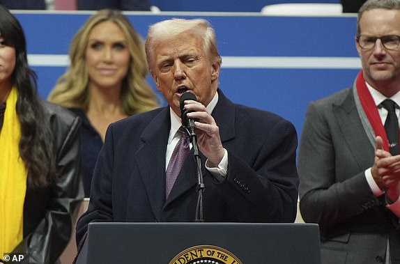 President Donald Trump speaks at an indoor Presidential Inauguration parade event in Washington, Monday, Jan. 20, 2025. (AP Photo/Matt Rourke)