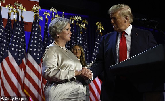 WEST PALM BEACH, FLORIDA - NOVEMBER 05: Republican presidential nominee, former U.S. President Donald Trump praises his campaign senior advisor Susie Wiles during an election night event at the Palm Beach Convention Center on November 06, 2024 in West Palm Beach, Florida. Americans cast their ballots today in the presidential race between Republican nominee former President Donald Trump and Vice President Kamala Harris, as well as multiple state elections that will determine the balance of power in Congress. (Photo by Chip Somodevilla/Getty Images)