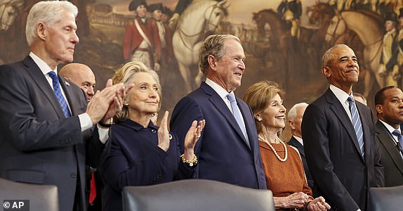 From left, former President Bill Clinton, former Secretary of State Hillary Clinton, former President George W. Bush, former first lady Laura Bush and former President Barack Obama, arrive before the 60th Presidential Inauguration in the Rotunda of the U.S. Capitol in Washington, Monday, Jan. 20, 2025. (Chip Somodevilla/Pool Photo via AP)