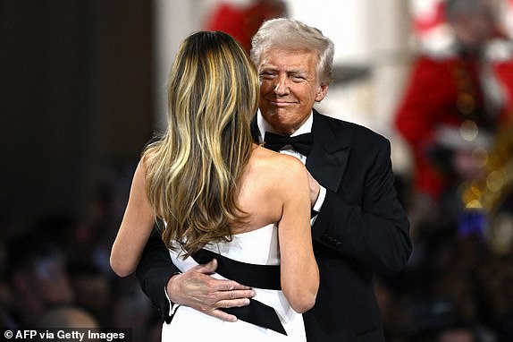 US President Donald Trump (R) and US First Lady Melania Trump dance to The Battle Hymn of the Republic during the Commander-In-Chief inaugural ball at the Walter E. Washington Convention Center in Washington, DC, on January 20, 2025. (Photo by Patrick T. Fallon / AFP) (Photo by PATRICK T. FALLON/AFP via Getty Images)