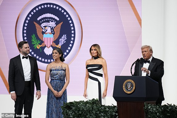 WASHINGTON, DC - JANUARY 20: President Donald Trump addresses the Commander and Chief Ball while First Lady Melania Trump, Vice President JD Vance, and 2nd Lady Usha Vance look on January 20, 2025 in Washington, DC.  President Trump attends some of the inaugural balls after taking the oath as the 47th president. (Photo by Andrew Harnik/Getty Images)