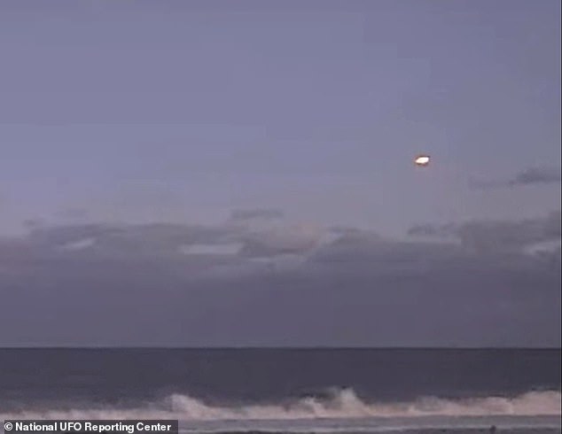 On December 21, 2024 at around 7:10pm in Atlantic City, one witness told NUFORC that they documented 'a strange flying saucer' that 'appeared to shake and change shape, but always returning to its original disc shape' (still image from the witnesses video submission above)