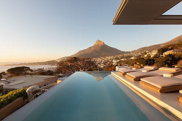 008 Villa is a seven-bedroom modern home, sleeping 14, with two infinity pools facing the Twelve Apostles mountain range and the Atlantic Ocean