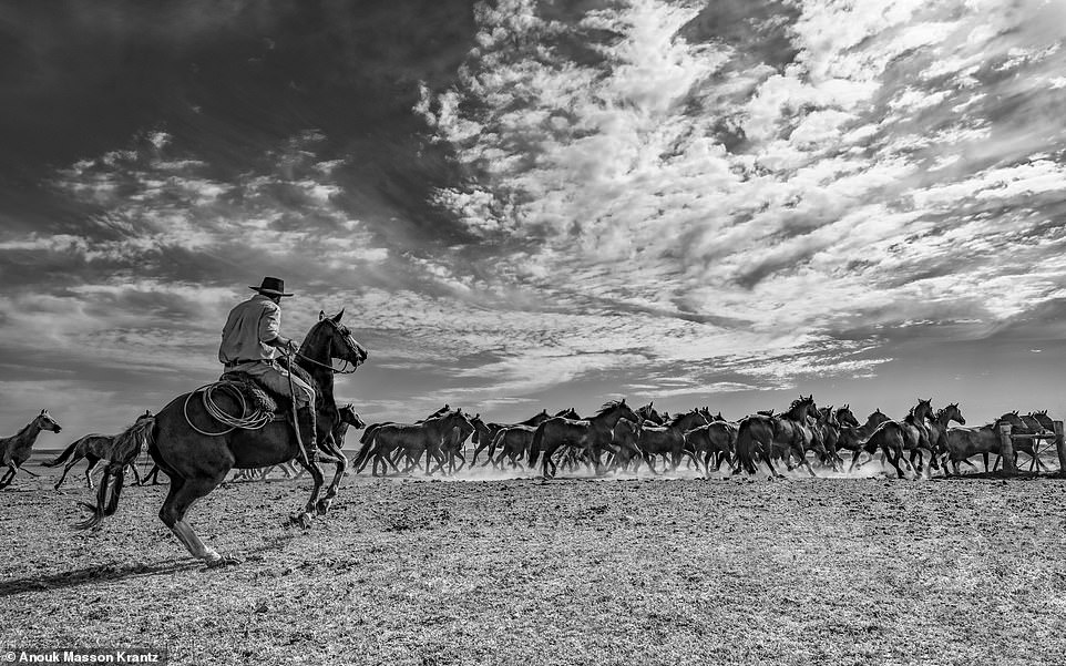 Above, a picture taken in Uruguay, where Spanish is predominately spoken. Anouk was amazed at how she and the cowboys on these foreign frontiers 'immediately had an unspoken mutual respect  and bond', despite not speaking the same language