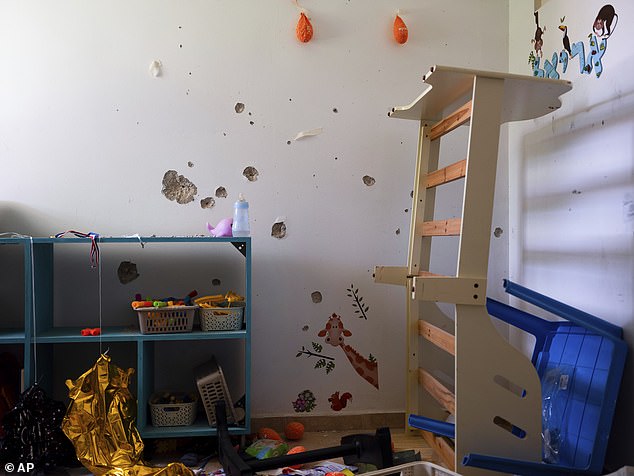 Bullet holes cover the bedroom wall of hostage Ariel Bibas, 4, at his home in Kibbutz Nir Oz, Israel